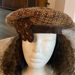 Brown and gold tweed with olive green beret with velvet trim and satin lining.